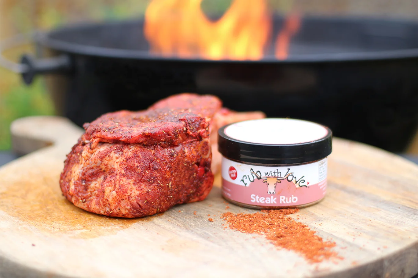 Steak Rub with meat on chopping board.